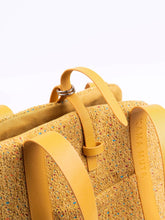 close-up-of-yellow-kamamuta-mini-tweed-tote-bag-leather-and-metal-hardware-details